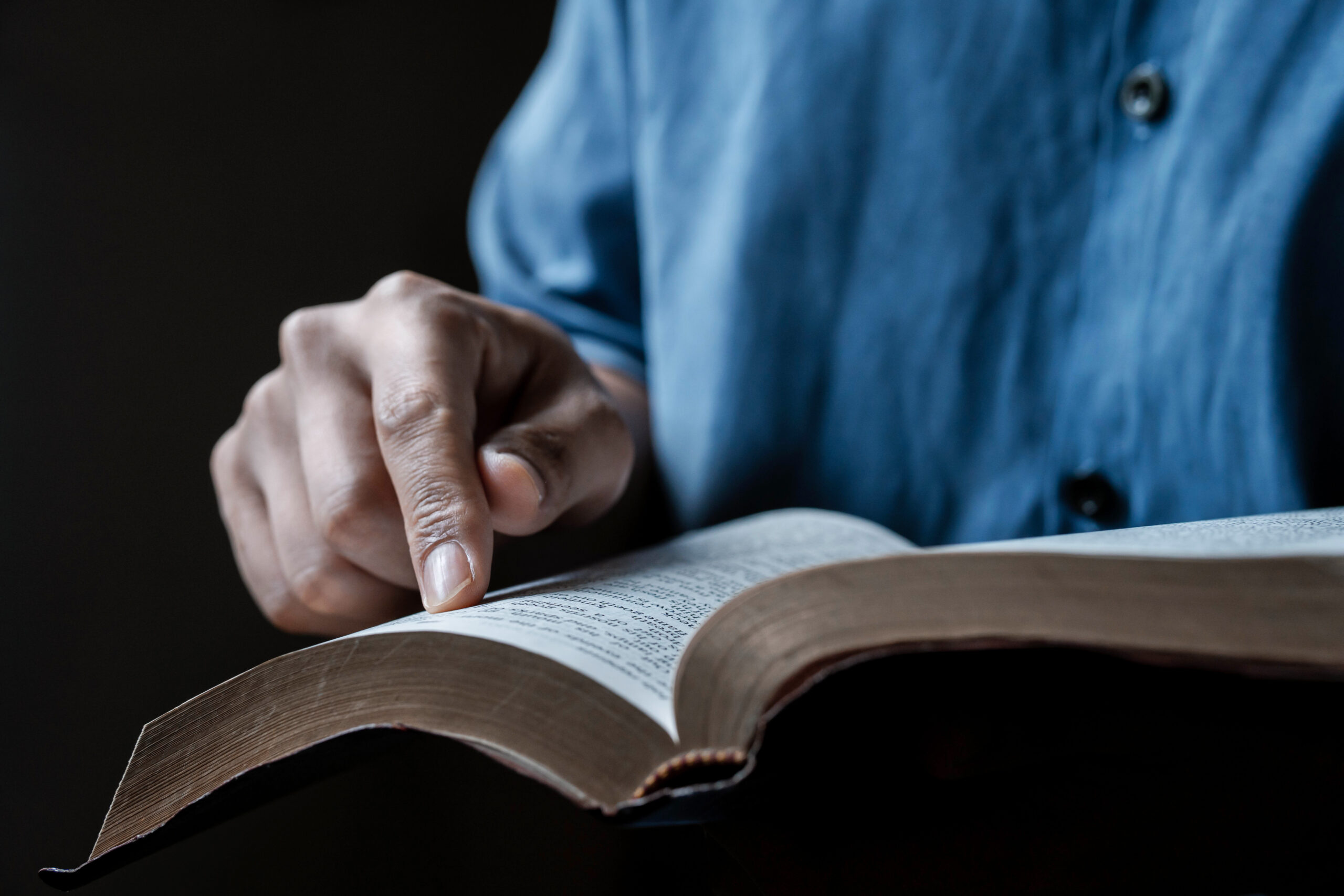 Close-up of a man reading the Bible Spiritual concepts by studyi